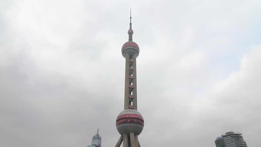 SHANGHAI - DECEMBER 17: Shanghai Oriental Pearl TV Tower and busy traffic. shot
