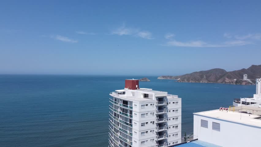 city, coastline, buildings, ocean, skyline