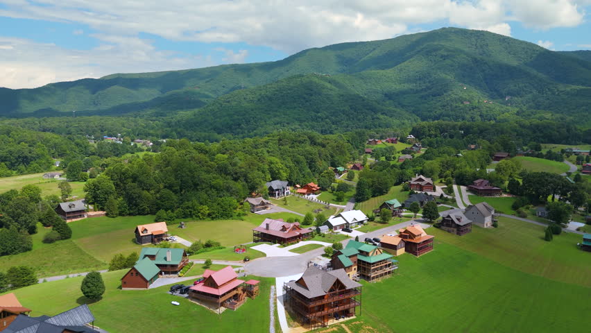 Mountain houses among green trees in Wears Valley, Tennessee and dramatic peaks with panoramic views in a quiet highland resort community