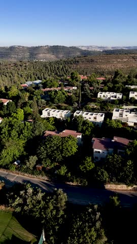 Vertical Drone Flight Over Kibbutz Tzuba Residential Area, Showing Homes, Community Housing Units, Green Surroundings and Scenic Jerusalem Mountains Landscape in Israel