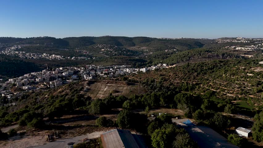 Vertical Drone Flight Over Kibbutz Tzuba Residential Area, Showing Homes, Community Housing Units, Green Surroundings and Scenic Jerusalem Mountains Landscape in Israel