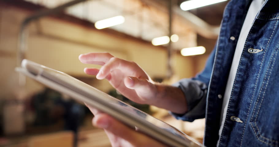 Carpentry, hands and tablet with man in workshop for planning, digital schedule or timetable. Furniture, warehouse and scrolling app with person in woodworking factory for online agenda or inventory