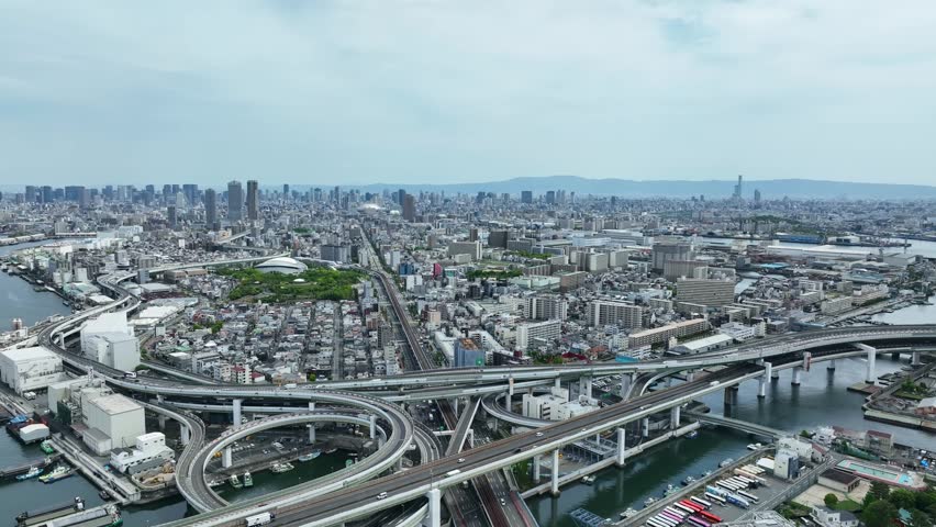 Aerial drone footage of city and road landscapes. Society, traffic, railways, tracks, infrastructure, roads.