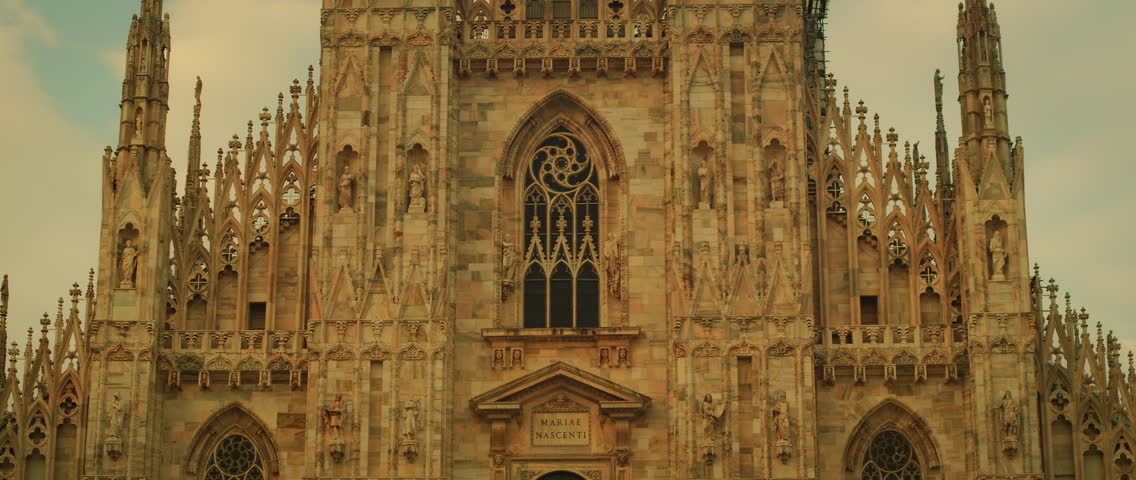 Close-up of Duomo gothic cathedral facade in summer light in central Milan Italy