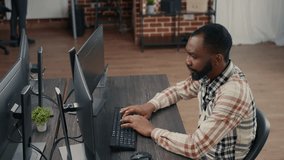 Database developer writes source code at a computer workstation, using keyboard input to build algorithms and digital applications - Powered by Shutterstock - Get 15% off with code: PIKWIZARD15