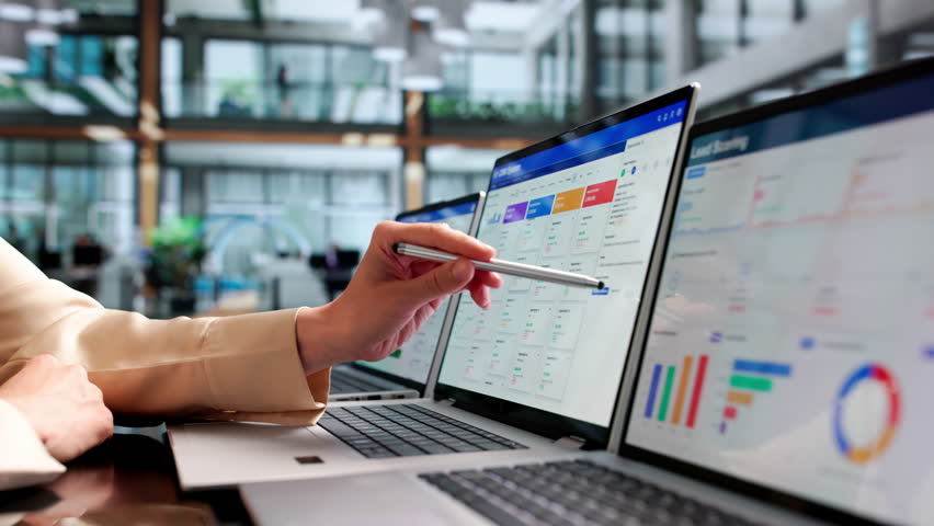 Sales Manager Reviewing Customer Data On Laptop To Improve Business Growth.