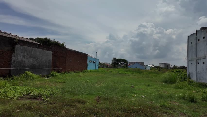 old warehouse in the village surrounded by grass