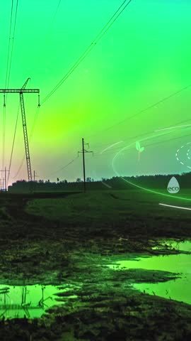 View of aurora borealis illuminating the night sky over a rural landscape with power lines and muddy fields in Latvia.