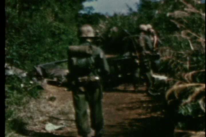 1960s - American marines take prisoners and search villages for secret tunnels during the Vietnam war