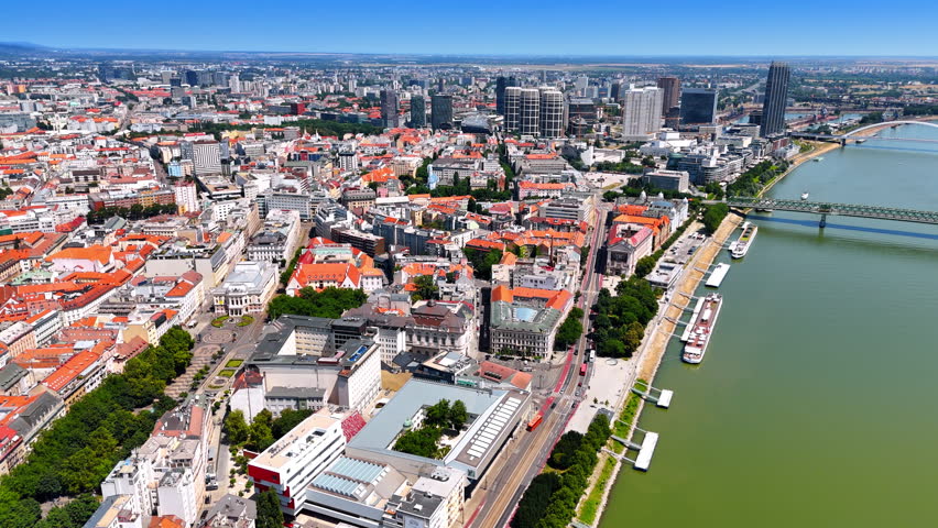 Historical part of the beautiful Bratislava, Slovakia. Drone footage over the waterfront of the Danube on sunny day.