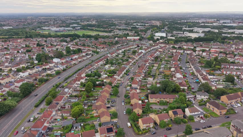 Aerial drone footage of Filton near Bristol, England, showcasing the urban landscape, residential areas, infrastructure, green spaces, and surrounding development