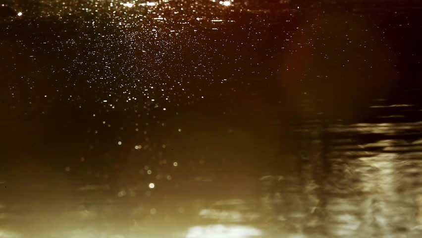Reflection of sunset in water for natural background with glow and glitter