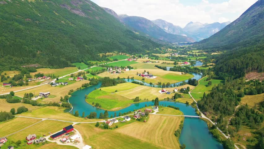 Aerial view of the winding river and lush green valley landscape in Stryn, Vestland, Norway.