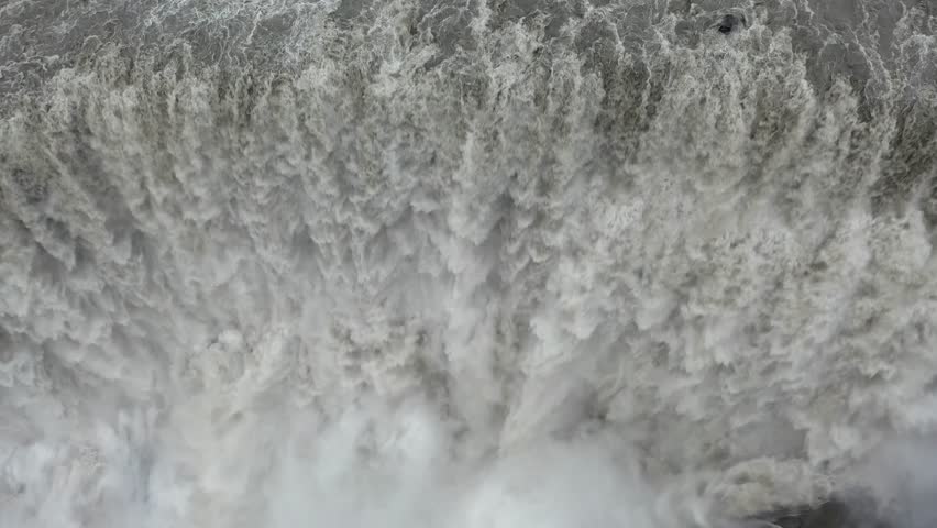 Aerial view of the powerful Selfoss waterfall with cascading water and mist in Selfoss, Sveitarfelagid Arborg, Iceland.