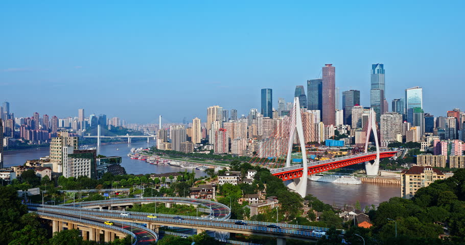 Modern city skyline with a river and bridge in Chongqing, China
