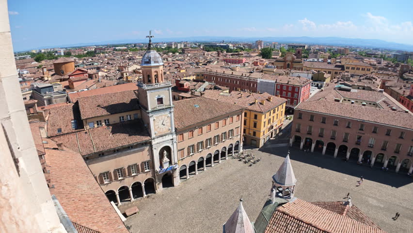 Expansive aerial shot capturing the vibrant Piazza Grande, heart of Modena city, as seen from Ghirlandina bell tower of Modena city in Italy