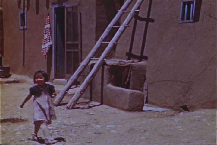 1940s - Tourists explore a Native American village in the 1940s