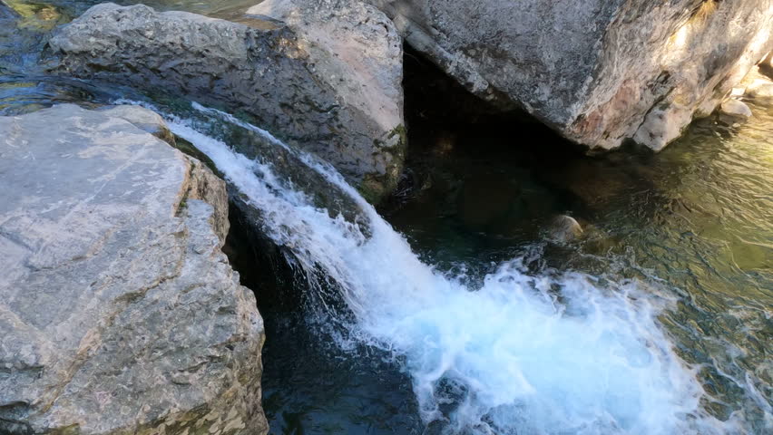 Footage of small waterfall on Brugent river. El Pinetell, Tarragona, Spain.