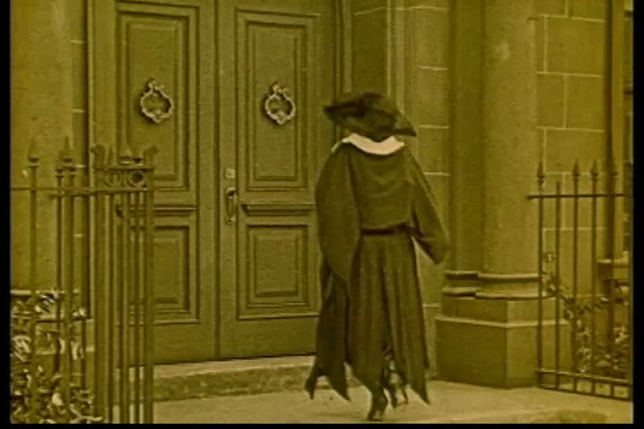 1920s - A woman shows a man his new room in an apartment