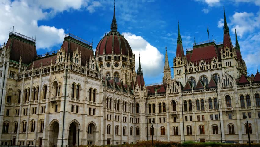 Close-up details of the majestic spires, towers, and intricate neo-Gothic facade of the Hungarian Parliament Building in Budapest, emphasizing its striking historic European architecture.