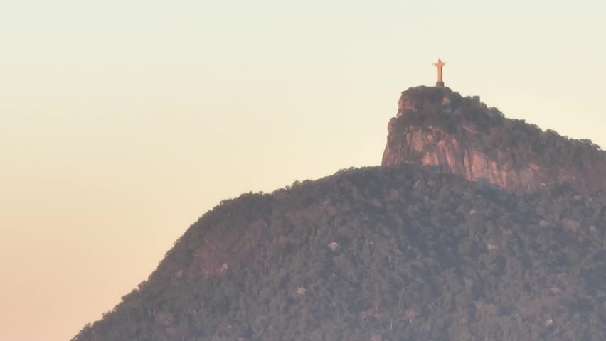 Rio de Janeiro in sunrise, Brazil. City center. Aerial view, establishing shot. Christ the Redeemer