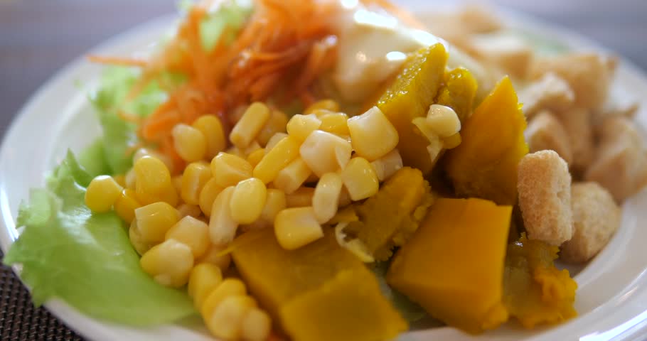 Close up of fresh vegetable salad with creamy dressing