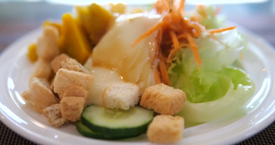 Close up of fresh vegetable salad with creamy dressing