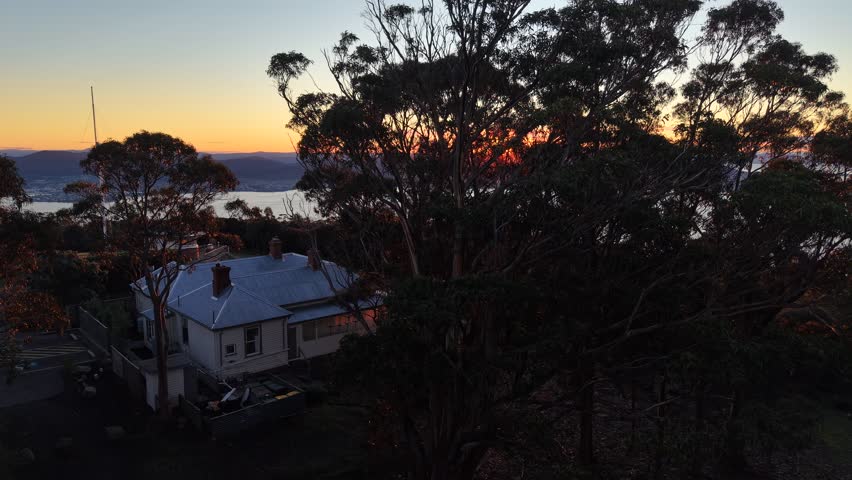 Aerial drone footage from Mount Nelson Lookout overlooking Hobart, Mount Wellington and the Derwent River, Tasmania, Australia