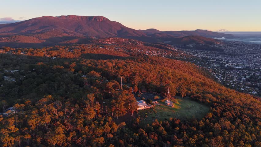 Aerial drone footage from Mount Nelson Lookout overlooking Hobart, Mount Wellington and the Derwent River, Tasmania, Australia