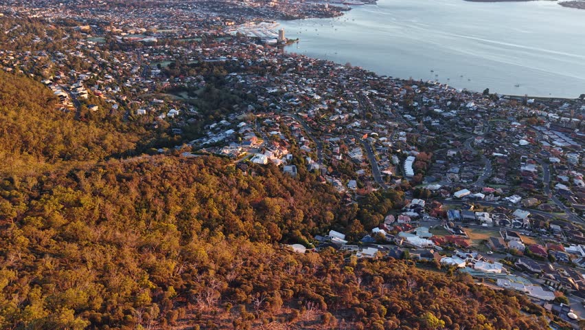 Aerial drone footage from Mount Nelson Lookout overlooking Hobart, Mount Wellington and the Derwent River, Tasmania, Australia