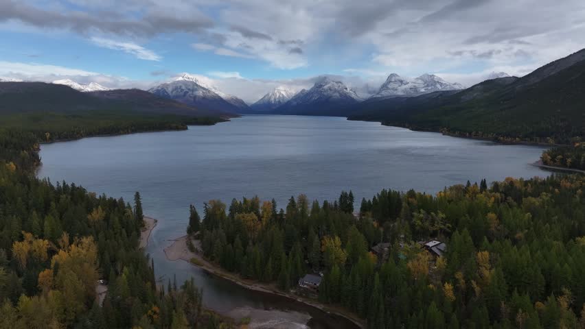 Aerial view of the snow-covered mountains and lakes in Glacier National Park, Montana, USA