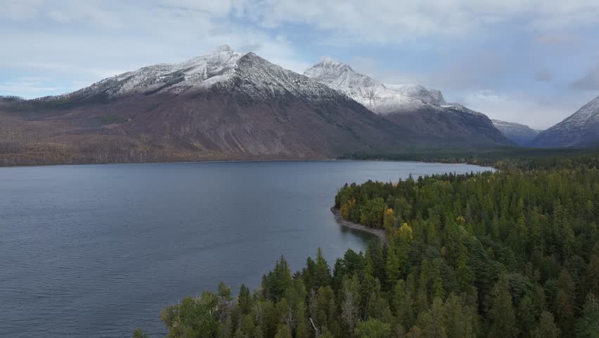 Aerial view of the snow-covered mountains and lakes in Glacier National Park, Montana, USA