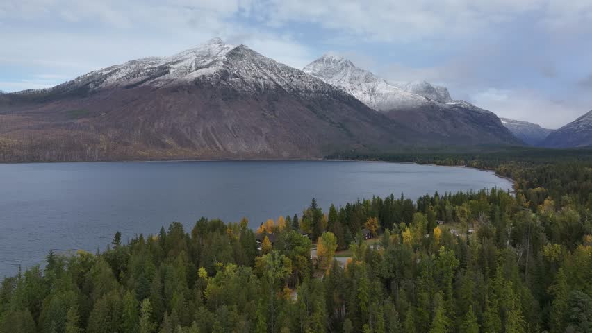 Aerial view of the snow-covered mountains and lakes in Glacier National Park, Montana, USA