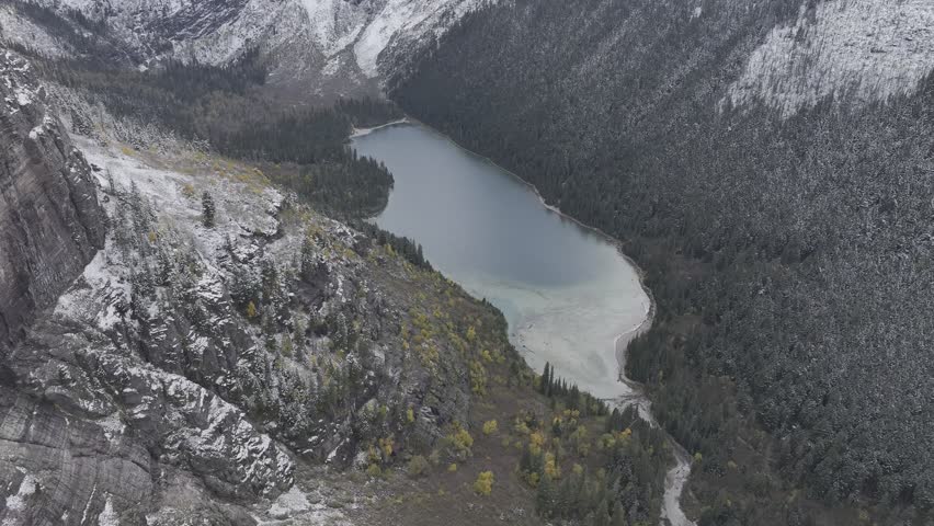 Aerial view of the snow-covered mountains and lakes in Glacier National Park, Montana, USA