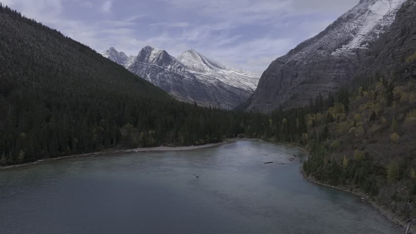 Aerial view of the snow-covered mountains and lakes in Glacier National Park, Montana, USA
