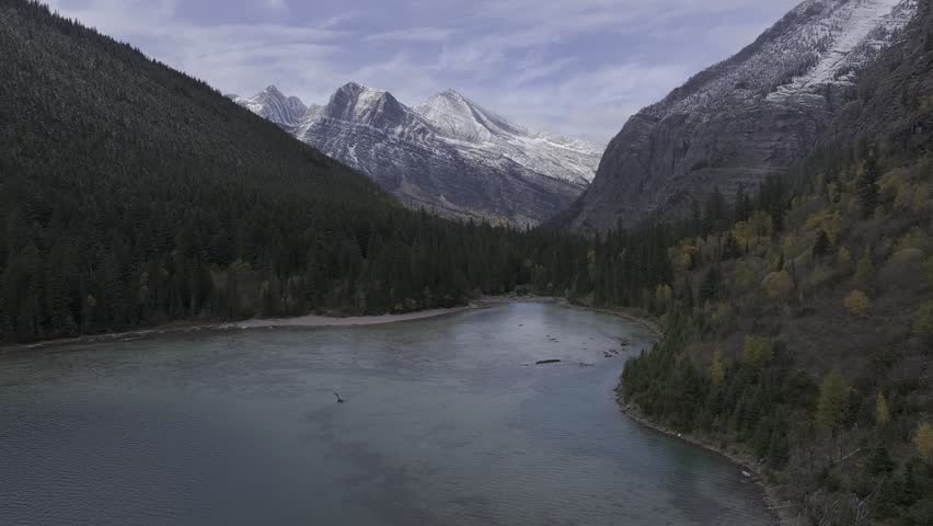 Aerial view of the snow-covered mountains and lakes in Glacier National Park, Montana, USA