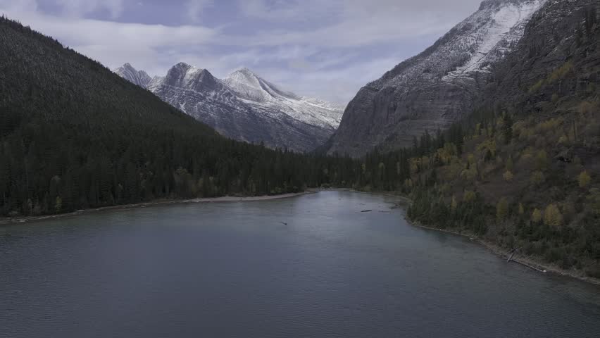 Aerial view of the snow-covered mountains and lakes in Glacier National Park, Montana, USA