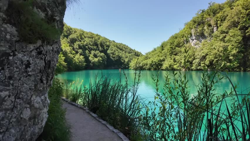 Scenic view of Beautiful Lake and Forest with a worden pathway on the side 