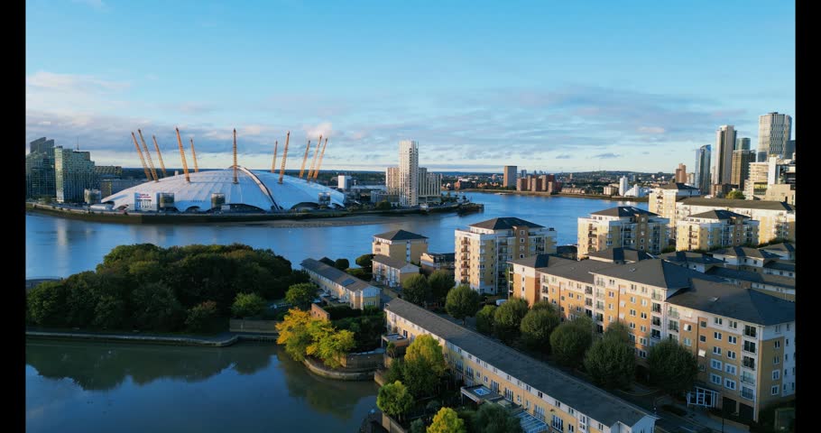 An aerial view of the O2 Arena in London overlooking the Greenwich Peninsula, surrounded by the city at sunrise. Taken from the Docklands area.
