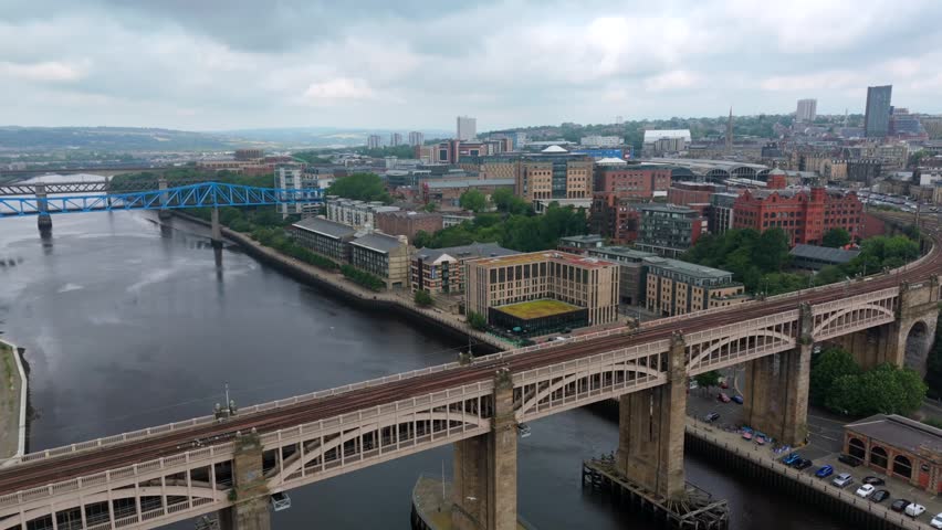 High Level Bridge crossing River Tyne in Newcastle, England, with city centre, Queen Elizabeth II Bridge and surrounding waterfront