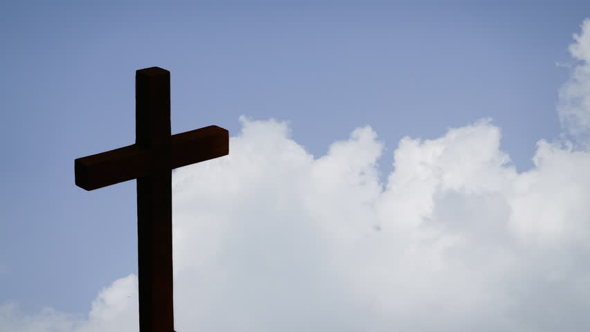 Silhouette Wooden Christian Cross of Jesus Blue Sky Clouds Timelapse Moving Loop Background