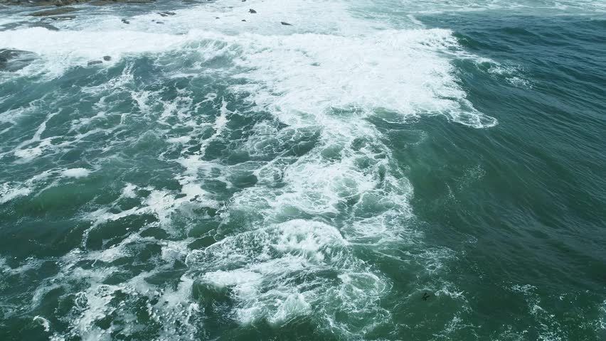 Abstract background of deep ocean water and bright white wave crests