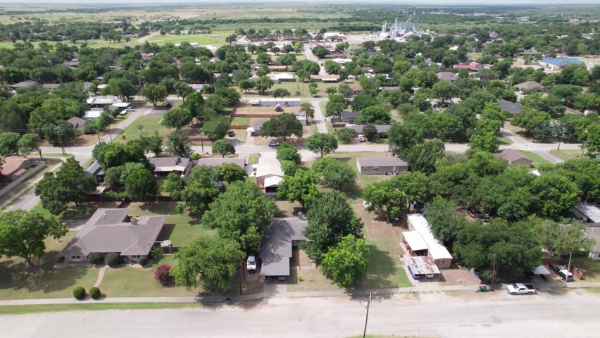 Aerial video of the city of Henrietta, Texas camera rises up