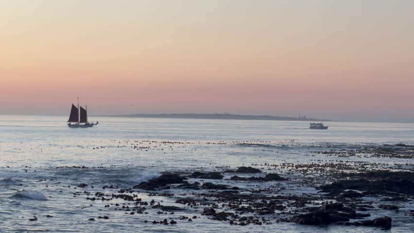 Dusk over Sea Point with boats on the horizon.