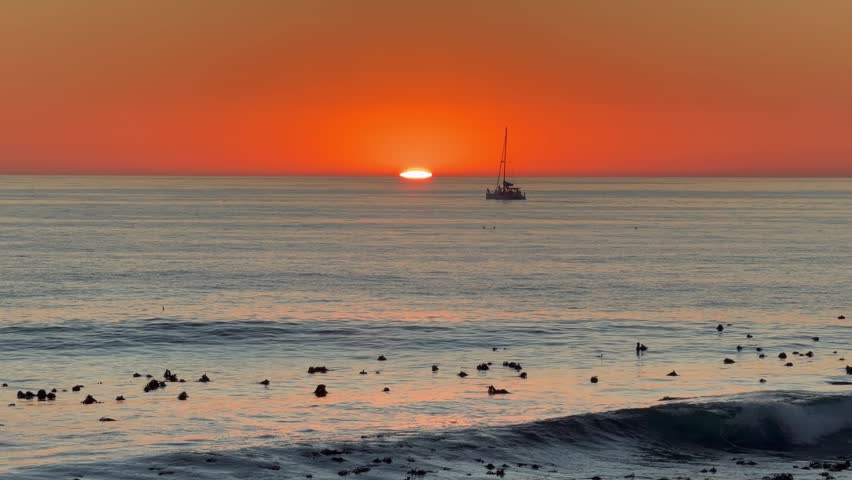 Sunset over the cold Atlantic Ocean near Sea Point, Cape Town.