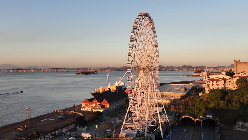 Rio de Janeiro in sunrise, Brazil. City center. Aerial view, establishing shot. Ferris wheel.