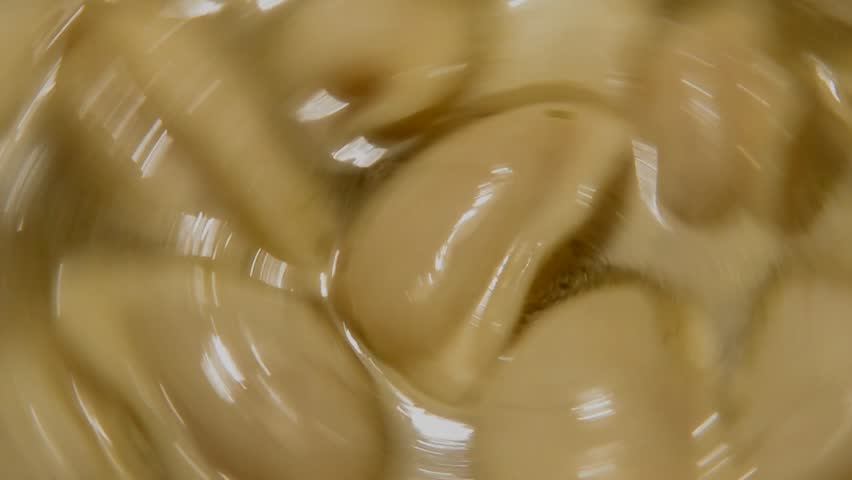 Dumplings are spinning is being prepared in a steel saucepan close-up