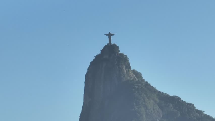 Rio de Janeiro in sunrise, Brazil. City center. Aerial view, establishing shot. Christ the Redeemer