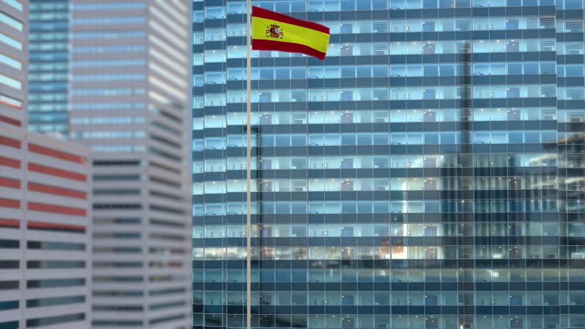 Spain Flag Waving Against Glass Office Building - Daylight Scene