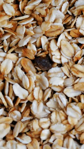 Granola. Oat flakes. Dry oat flakes, grains with berries and nuts. close-up. top view. Food background. Macro rotation. healthy, organic food. Gastronomy. rotation food.